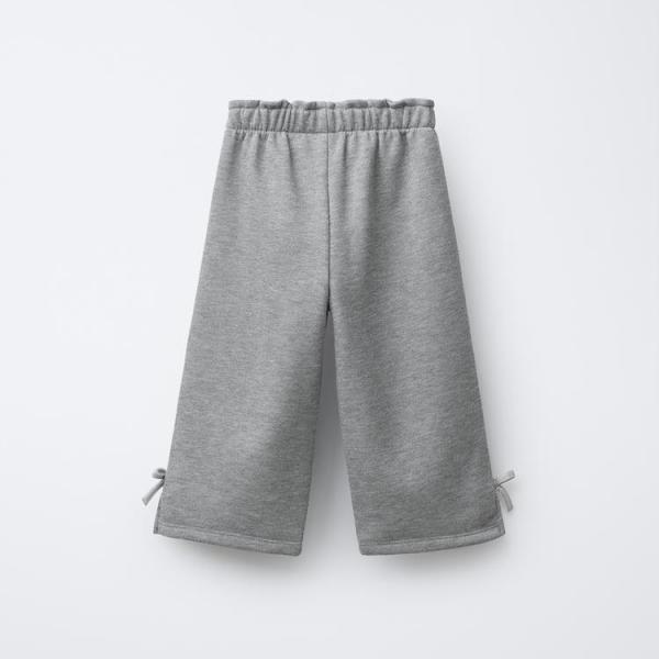 PLUSH TROUSERS WITH SHINY BOWS